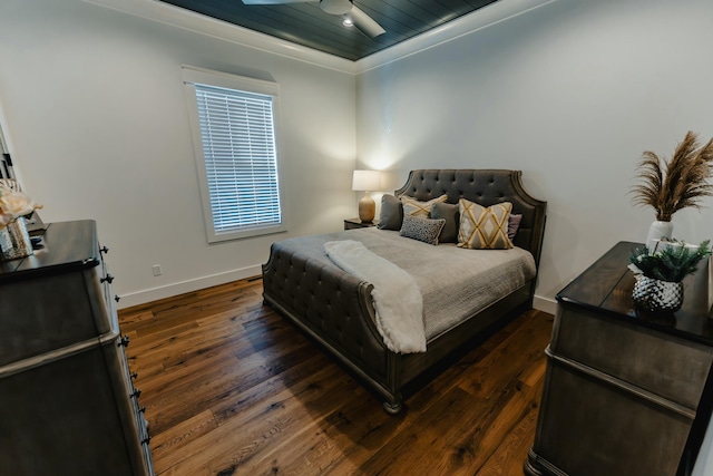 bedroom with ceiling fan, dark hardwood / wood-style flooring, and crown molding