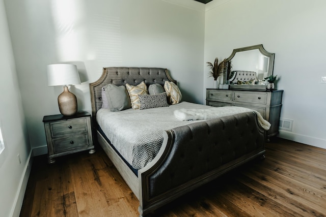 bedroom featuring dark hardwood / wood-style floors