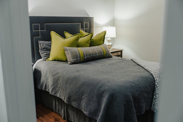 bedroom featuring dark hardwood / wood-style flooring