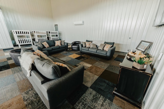 carpeted living room featuring a wall mounted air conditioner