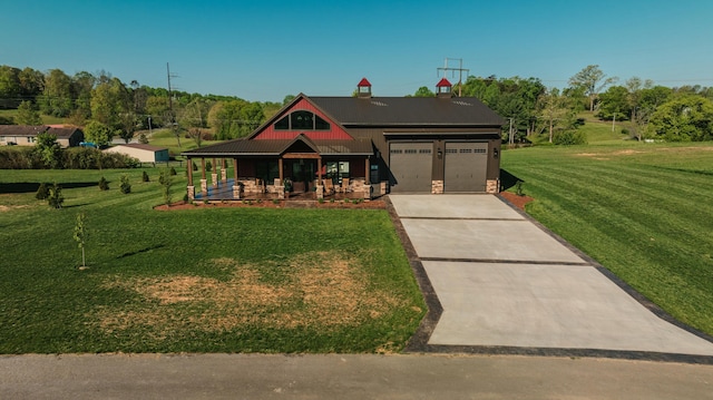 view of front of property featuring a front yard, a porch, and a garage