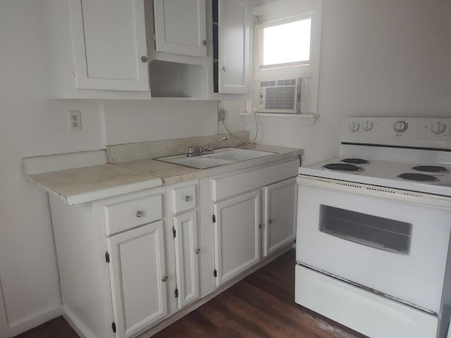 kitchen featuring white electric stove, white cabinetry, sink, and dark hardwood / wood-style floors