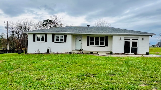 ranch-style house with a front lawn