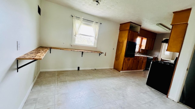 kitchen featuring a textured ceiling