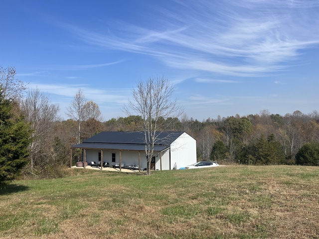 view of outbuilding with a wooded view