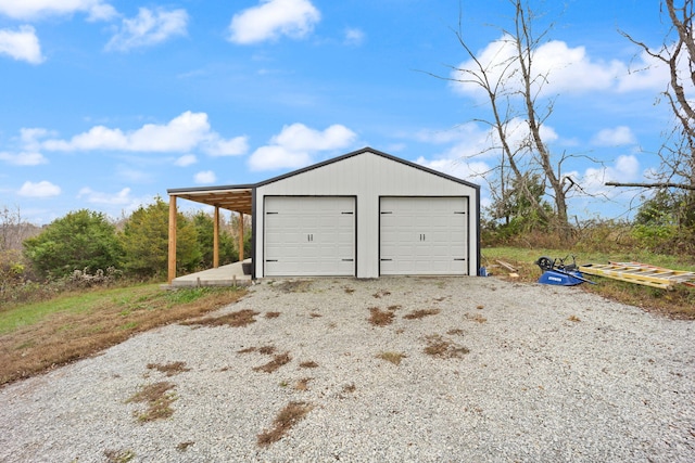 garage featuring a garage and driveway