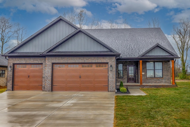 view of front of home featuring a front yard and a garage