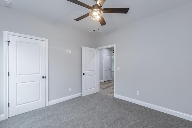 unfurnished bedroom featuring ceiling fan and carpet floors