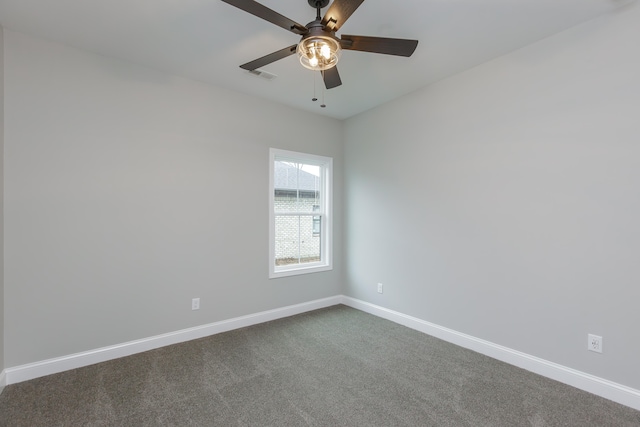 spare room with ceiling fan and carpet floors