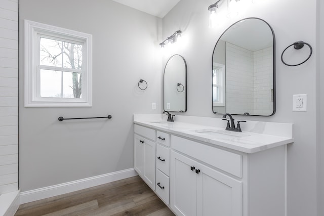 bathroom with hardwood / wood-style floors and vanity