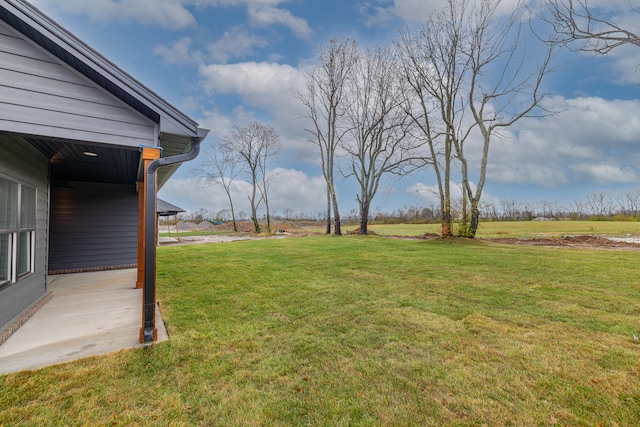 view of yard with a rural view