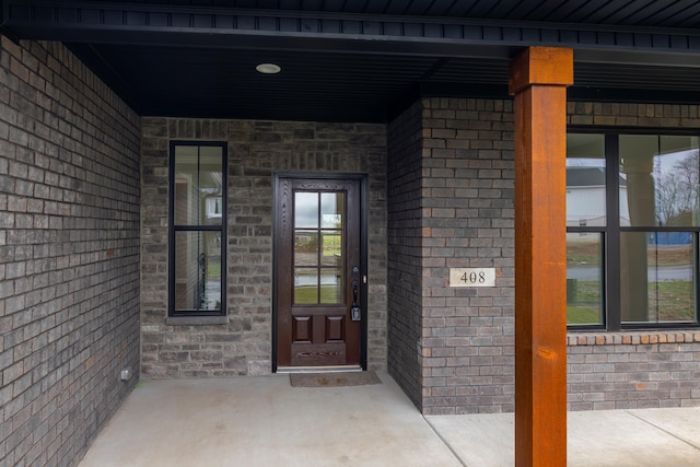 doorway to property with covered porch