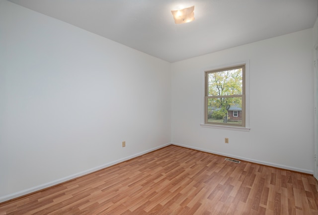 unfurnished room featuring light hardwood / wood-style flooring