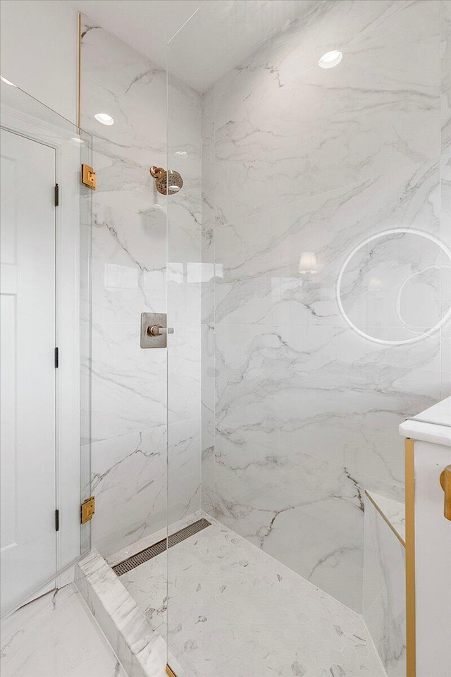 full bathroom featuring a marble finish shower and marble finish floor