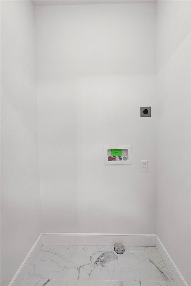 washroom with baseboards, marble finish floor, laundry area, and electric dryer hookup
