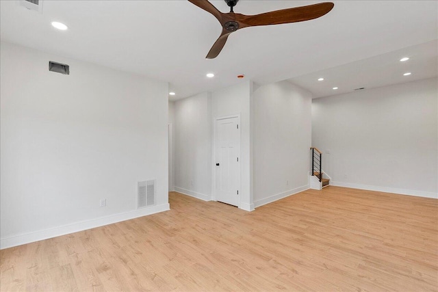 empty room featuring light wood-style floors, visible vents, a ceiling fan, and recessed lighting