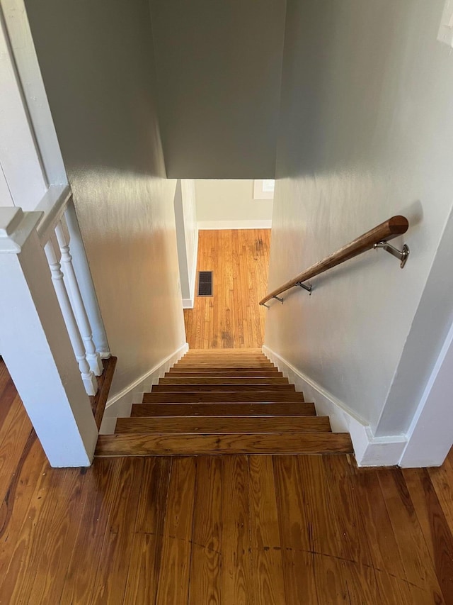 stairway with wood-type flooring