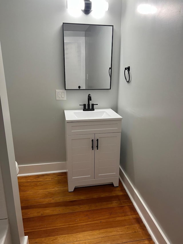 bathroom featuring vanity and wood-type flooring