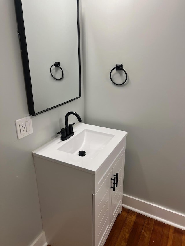 bathroom featuring hardwood / wood-style floors and vanity