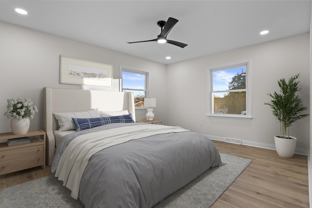 bedroom featuring ceiling fan and light hardwood / wood-style floors