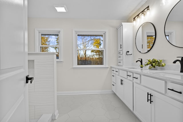 bathroom with vanity and tile patterned flooring