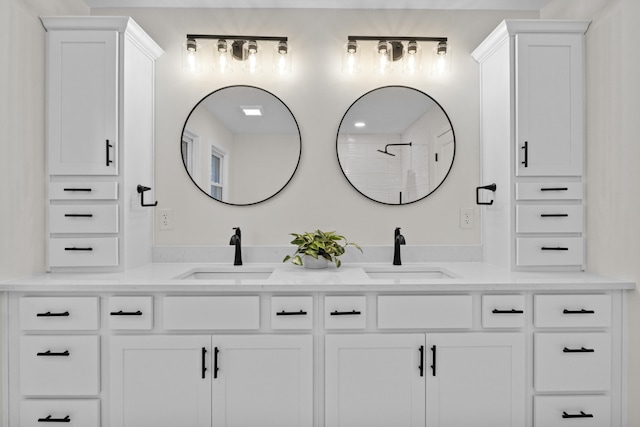 bathroom featuring vanity and a shower