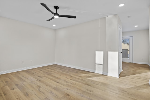 unfurnished room featuring ceiling fan and light hardwood / wood-style flooring