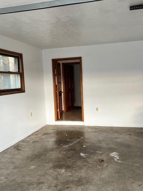 empty room with a textured ceiling