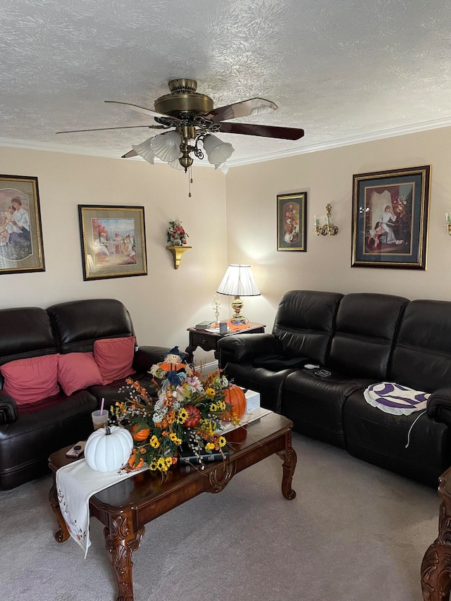 living room featuring ornamental molding, carpet floors, a textured ceiling, and ceiling fan