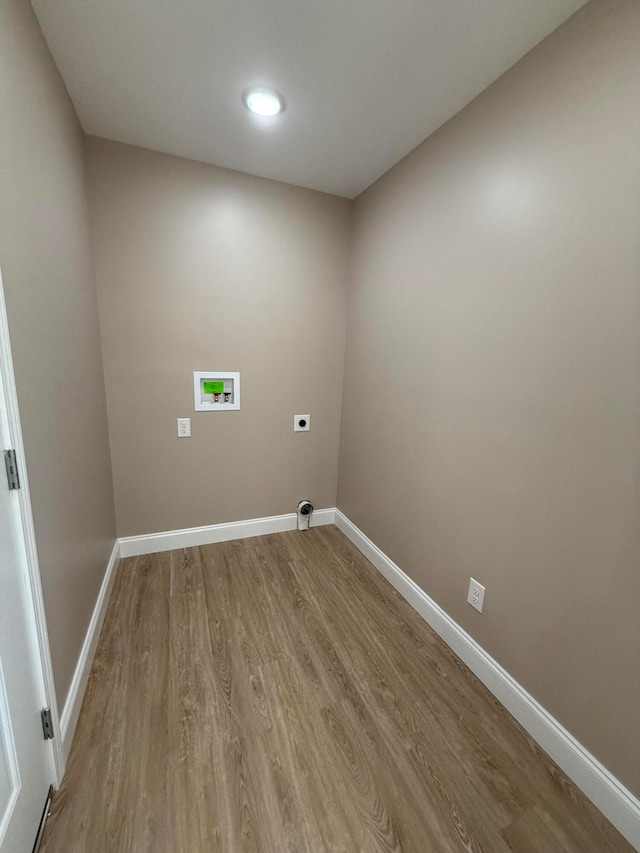 laundry room featuring washer hookup, wood-type flooring, and hookup for an electric dryer