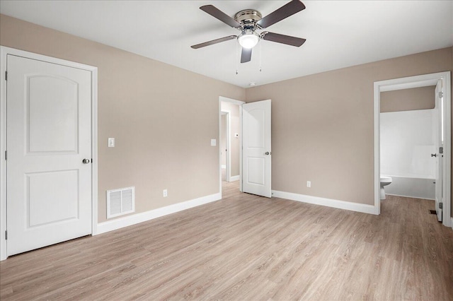 unfurnished bedroom with ensuite bathroom, light hardwood / wood-style flooring, and ceiling fan