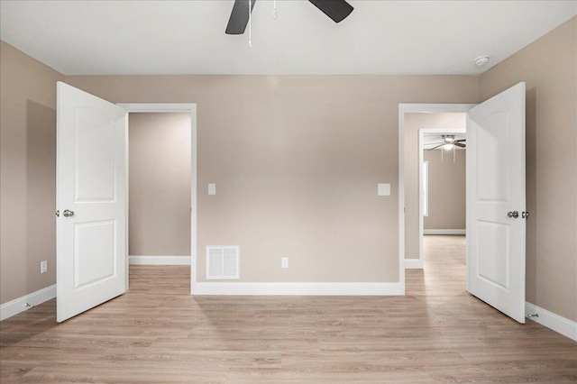 unfurnished bedroom featuring ceiling fan and light wood-type flooring