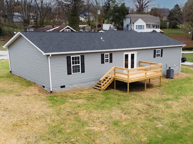 back of property featuring central AC, a yard, a wooden deck, and french doors