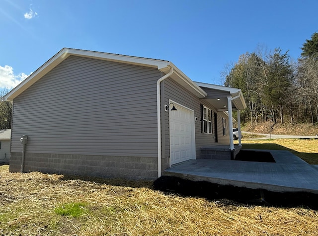 view of property exterior with a garage