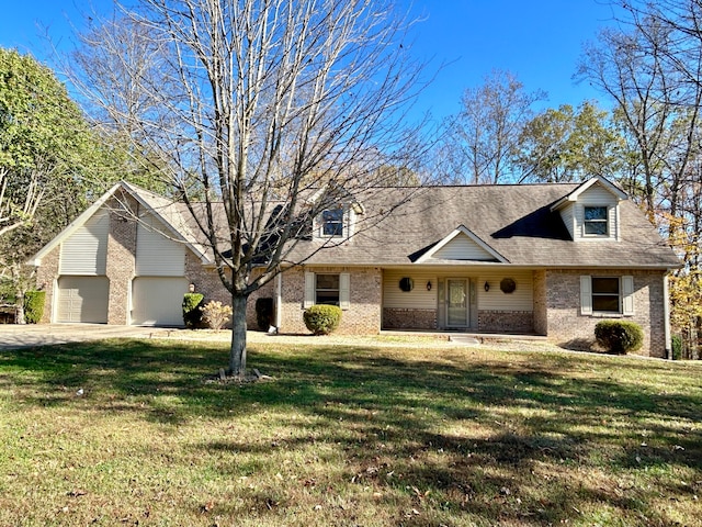 view of front of property with a garage and a front lawn