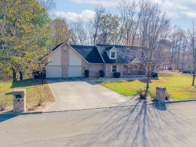 new england style home with a garage and a front lawn