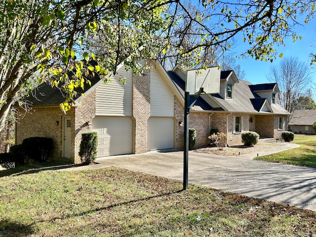 view of side of property with a garage and a yard