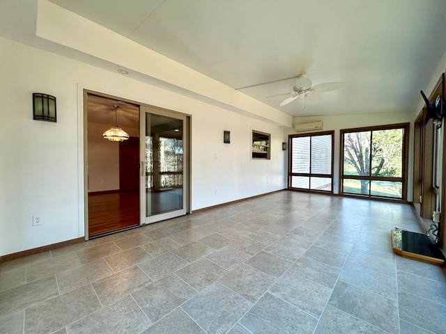 interior space featuring a wall mounted air conditioner, ceiling fan with notable chandelier, and lofted ceiling