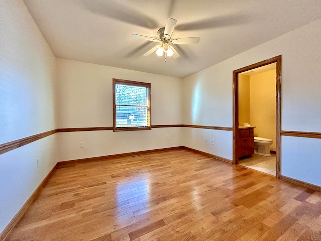 unfurnished room featuring ceiling fan and light wood-type flooring