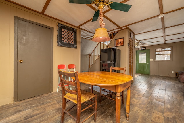 dining area with lofted ceiling with beams, hardwood / wood-style flooring, and ceiling fan