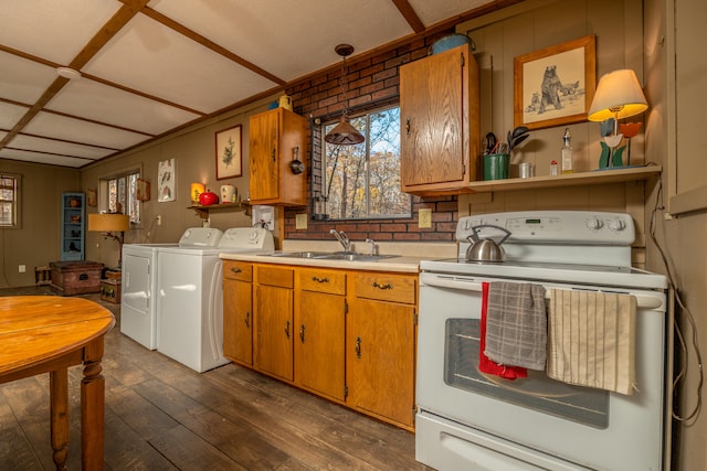 kitchen featuring dark hardwood / wood-style flooring, white electric range oven, sink, pendant lighting, and washing machine and dryer