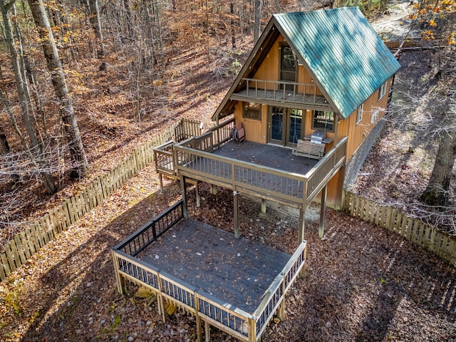 back of property featuring a wooden deck