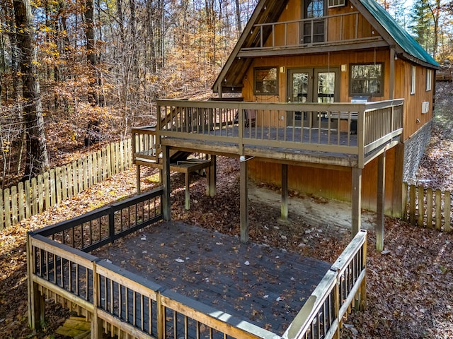 rear view of property featuring a deck