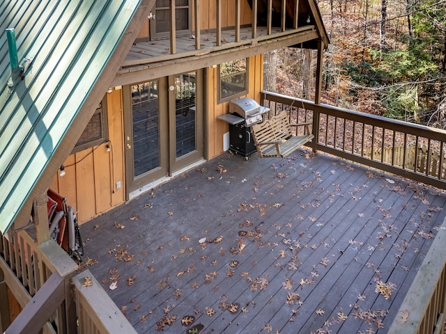 wooden deck featuring area for grilling