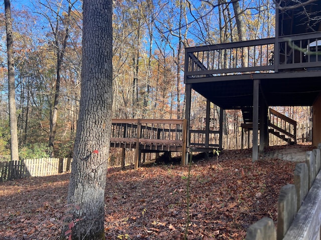 view of property exterior featuring a wooden deck