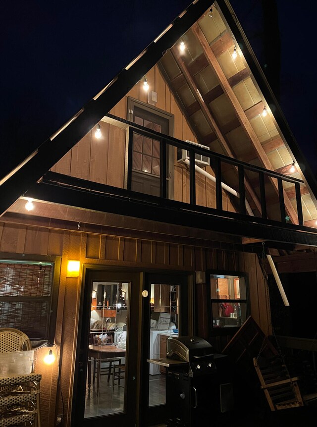 back house at night with independent washer and dryer