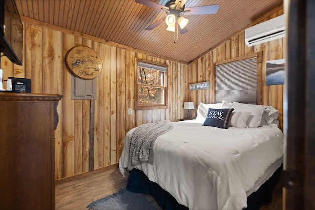 bedroom featuring ceiling fan, wooden ceiling, and wood walls