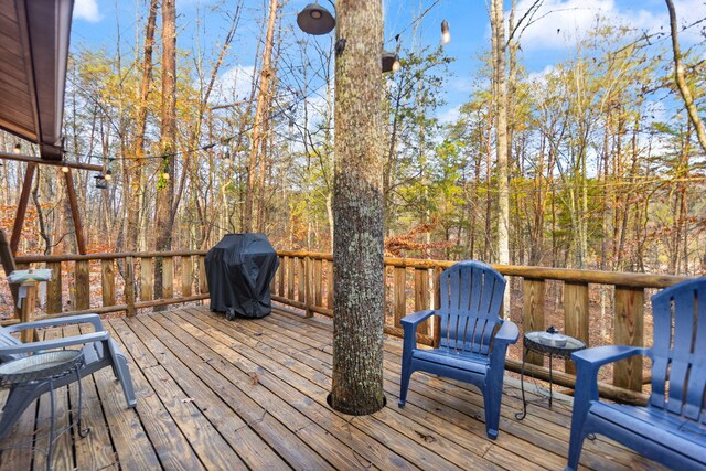 wooden terrace with area for grilling