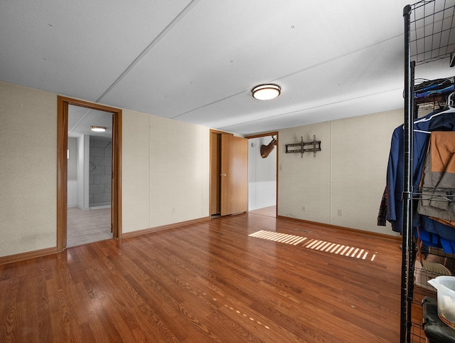 empty room with hardwood / wood-style flooring