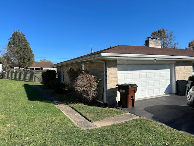 view of property exterior featuring a yard and a garage